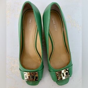 Open two heels with gold “shoe brooch” (women’s size 11)